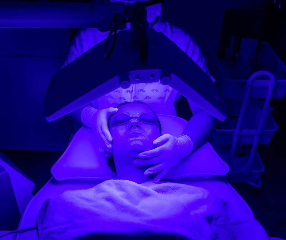 Patient receiving blue LED facial therapy