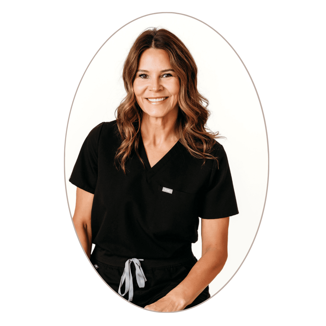 Smiling woman in black medical scrubs